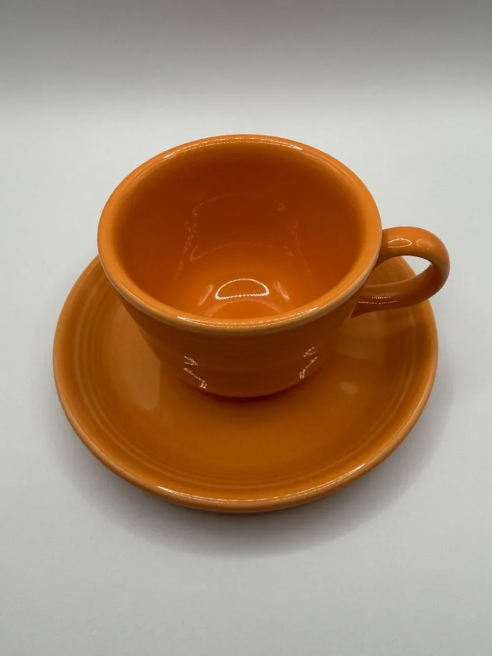 Fiesta Ware Pumpkin Orange Cup & Saucer Set